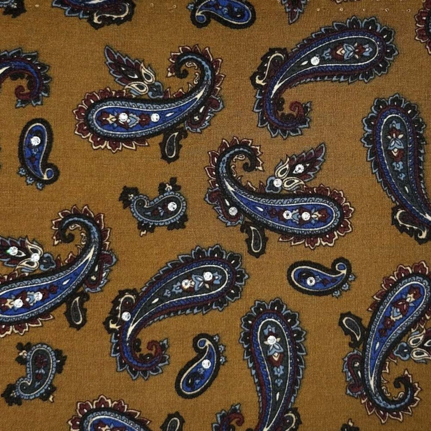 Paisley-patterned fabric in rich caramel tones, embellished with sparkling crystals.
