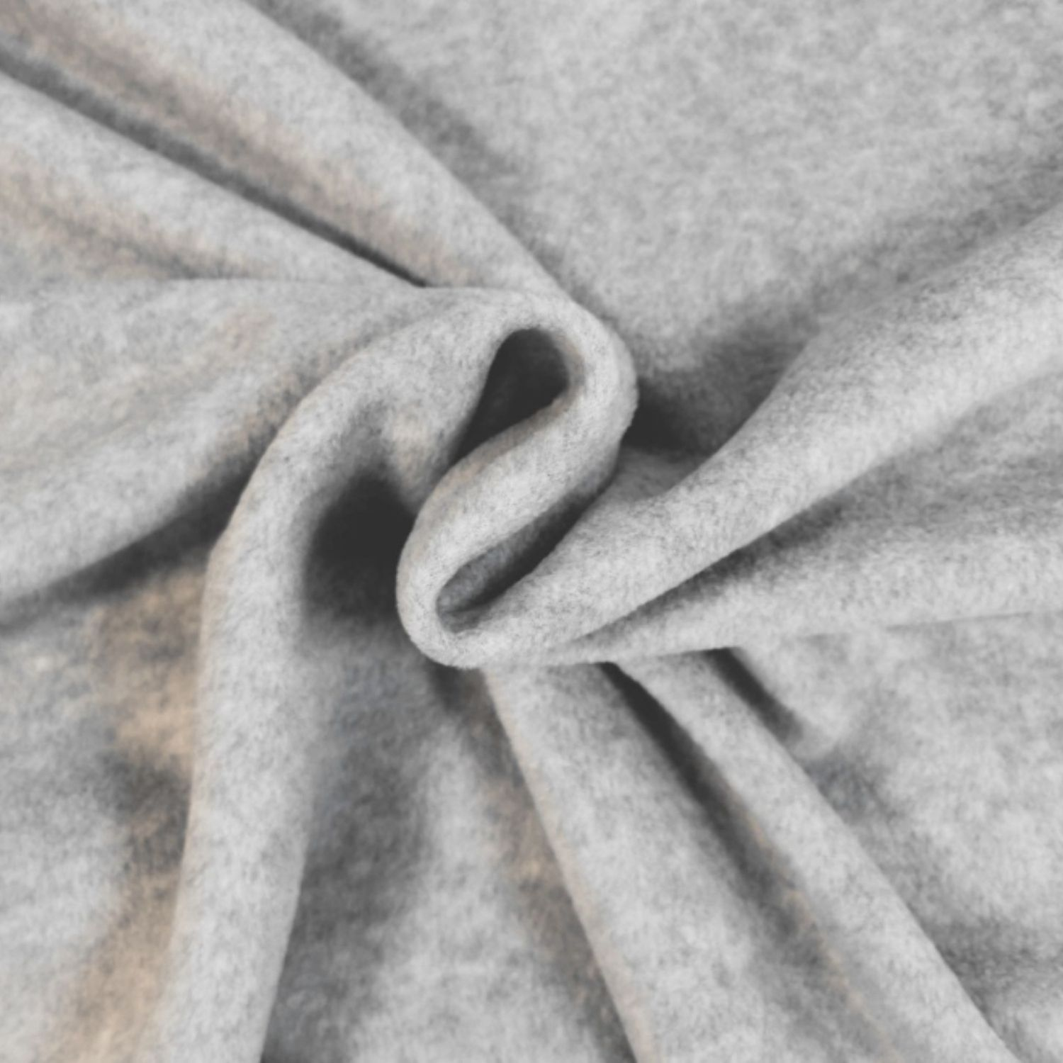 “Close‑up view of light-grey fleece fabric, showing its soft, plush, and slightly fuzzy texture.”