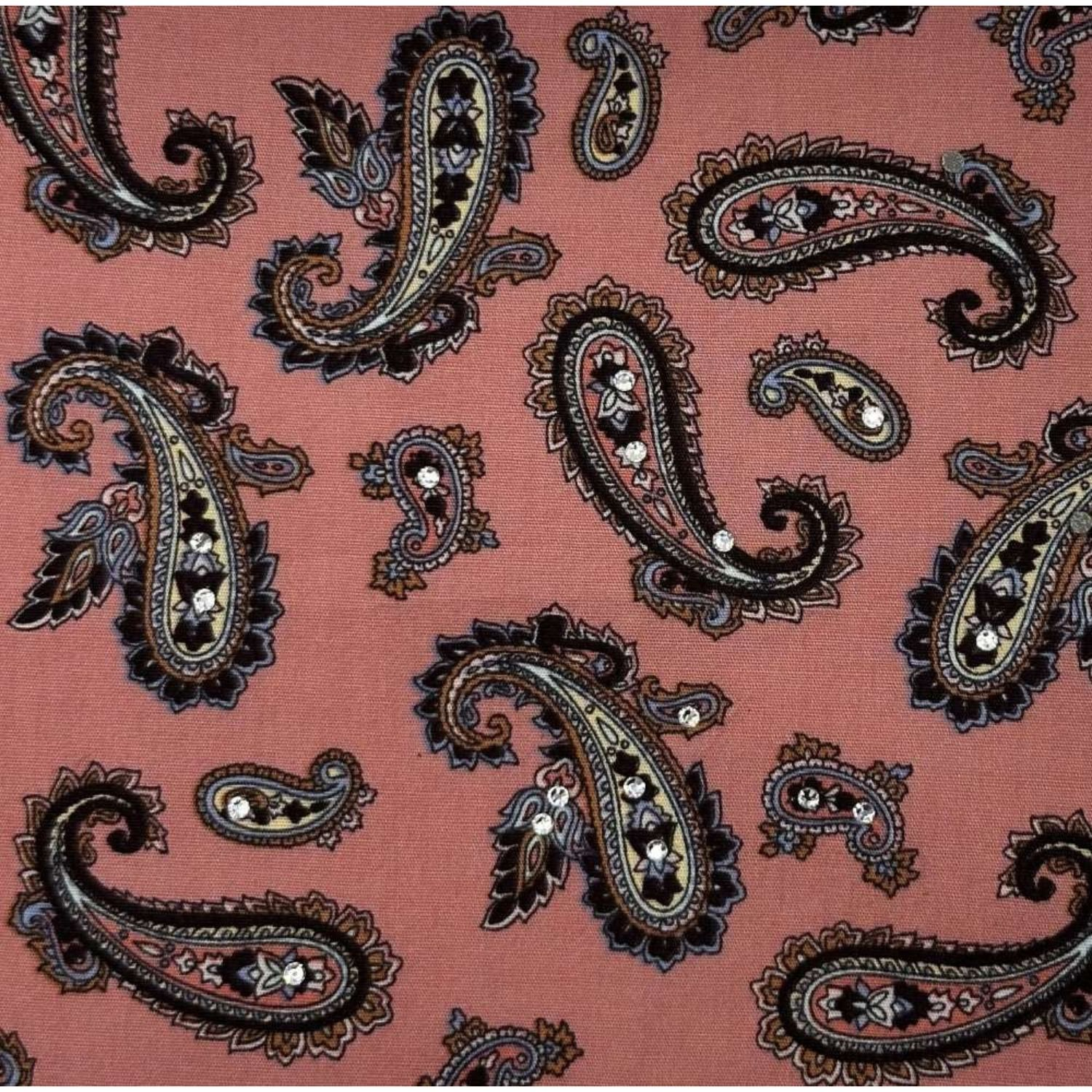 Paisley-patterned fabric in rich pink tones, embellished with sparkling crystals.