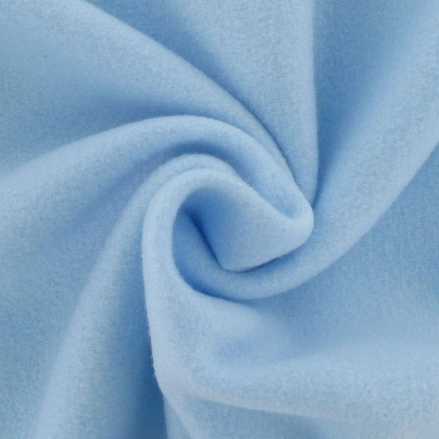 “Close‑up view of soft baby‑blue fleece fabric, showing its plush, fuzzy texture and gentle surface detail.”